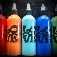 Five squeeze bottles with LoliVefe branding in red, orange, blue, and green on a dark background.